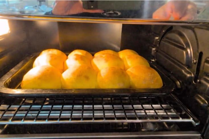 Soft sweet potato sourdough dinner rolls baked until golden brown.